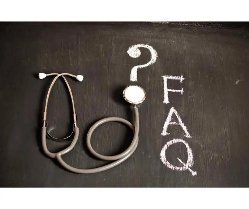 Stethoscope with the word FAQ and a question mark written in chalk on a blackboard, symbolising medical counselling and frequently asked questions about MBBS counselling services.