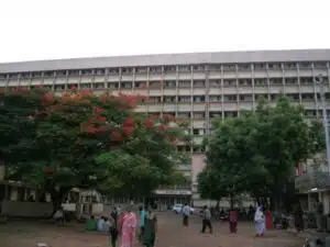 Modern medical college building with students and greenery in front, associated with MBBS counselling services for top medical universities.