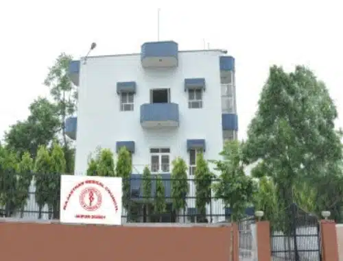 Modern medical college building with MBBS counselling services, surrounded by greenery and fencing, offering professional guidance for medical aspirants in India.